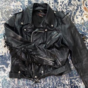 Vintage leather jacket with fringe detail.